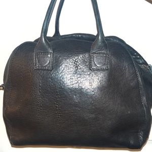 Very Spacious bag. Great for traveling. Italian leather. Soo Chic!